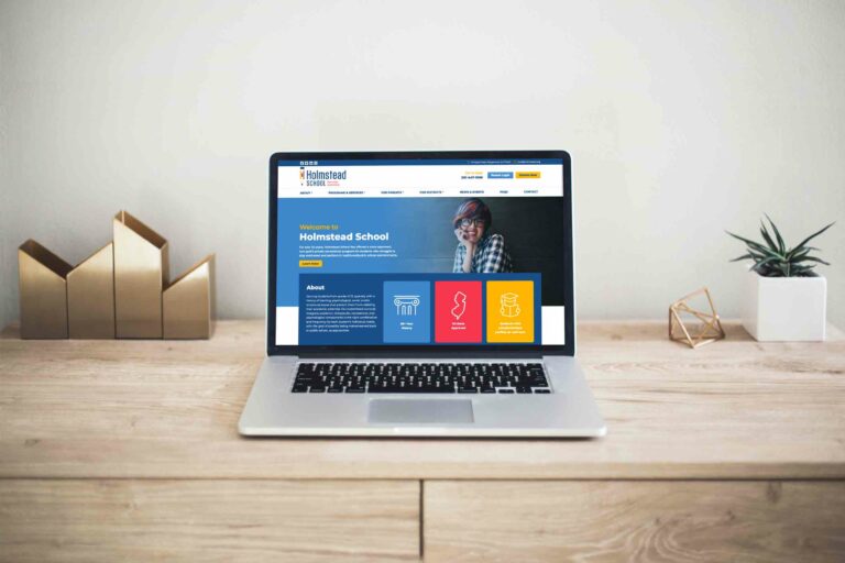 holmstead-website-on-laptop
