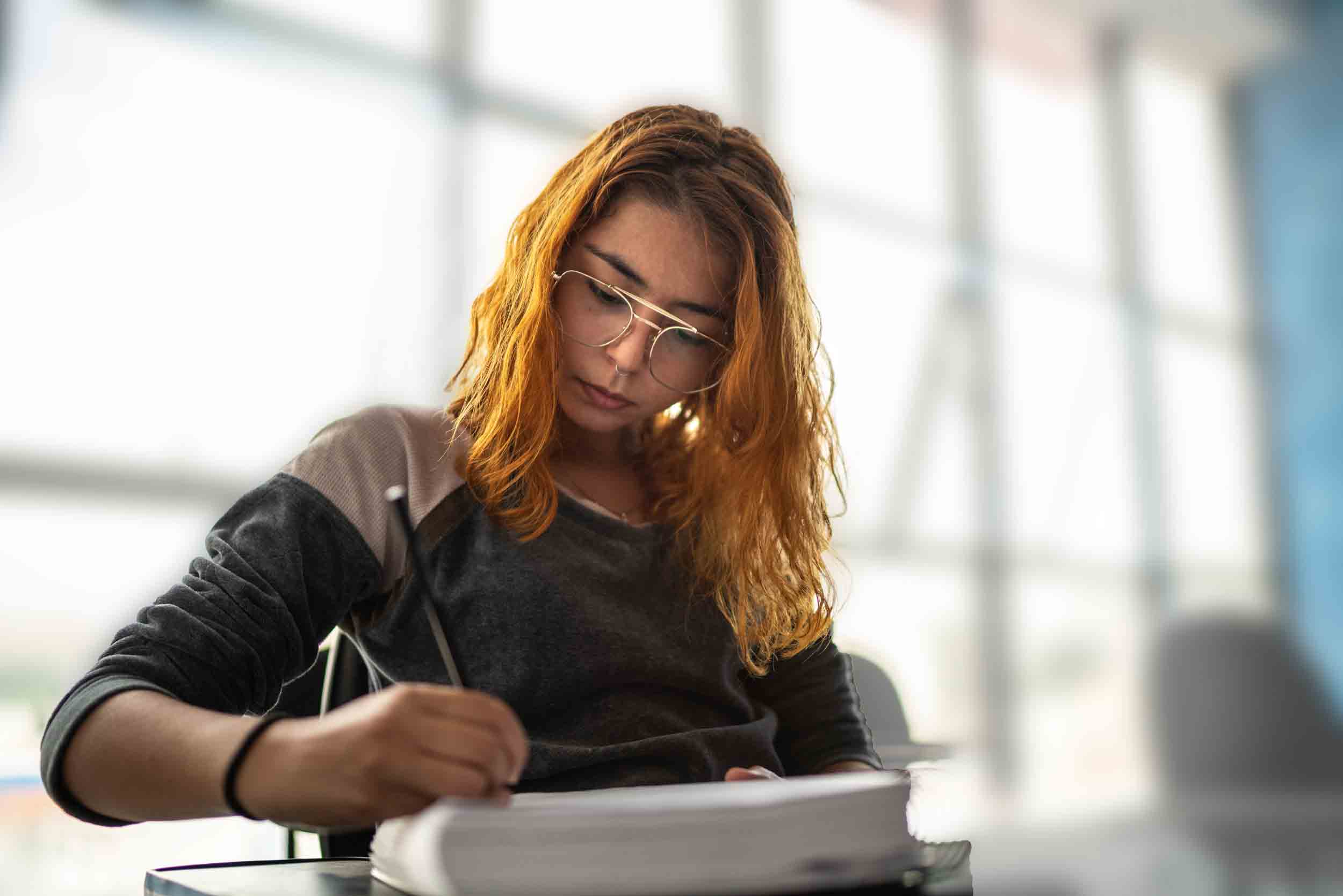 Student taking notes during class